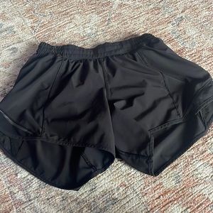 Lulu lemon hotty hot shorts in color black. Size 4 tall.